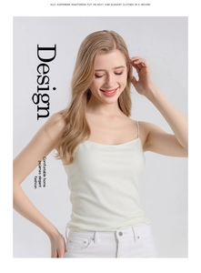 Detail of elegant white mulberry silk camisole with thin straps and smooth texture