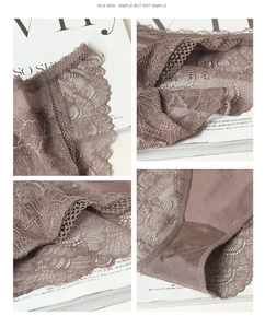 Detail of mauve silk lace panties showing delicate floral patterns and soft texture