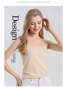 Detail of elegant beige silk camisole top with thin straps and smooth satin texture