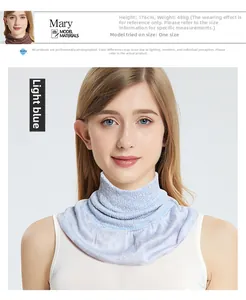 Detail of light blue mulberry silk neck gaiter on model with sizing parameters