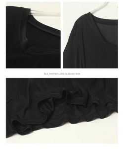 Detailed views of silk printed black long sleeved shirt neckline and hem stitching