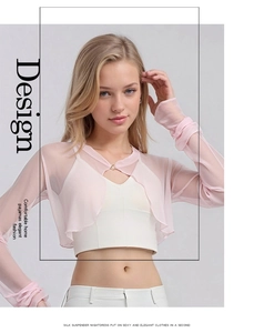 Detail of pink silk mesh sun protection jacket with buttons and light texture