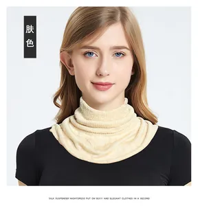 Close-up of beige 100% mulberry silk neck gaiter with elastic high-collar knitted texture