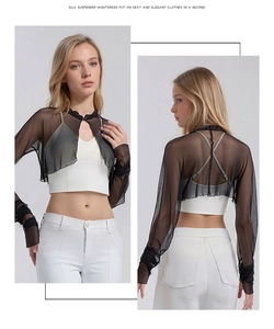 Detail of black mesh silk sun protection bolero with metal buckle and sheer long sleeves