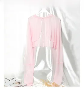 Detail of pink silk sun protection shrug showing mesh texture and single button closure