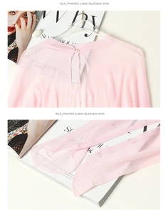 Detail of light pink mulberry silk sun protection top with back button and mesh texture