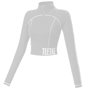 Haut de yoga gris à demi-zip avec manches longues et surpiqûres blanches contrastées