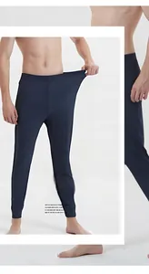 Detail of high elasticity navy blue thermal pants showing stretchable spandex material