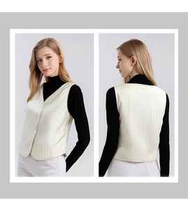 Detail of mulberry silk jacquard vest featuring V-neck design and polished buttons