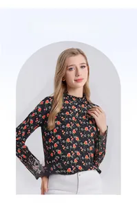 Close-up of elegant floral silk top featuring red rose patterns and ruffle stand collar