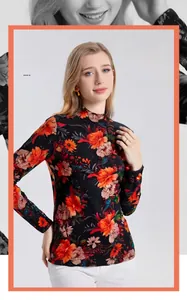 Detail of 100% fine wool fabric with vibrant floral print on a black turtleneck top