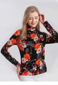Detail of floral printed turtleneck sweater in superfine wool with orange flower patterns