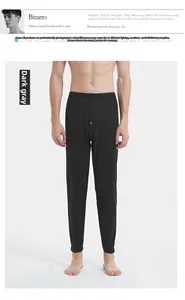 Detail of dark gray men's thermal leggings featuring elastic waistband and buttoned fly