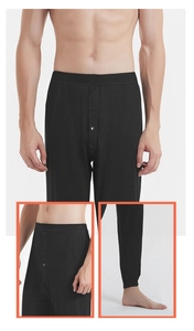 Detail view of men's thermal silk pants featuring elastic waistband and ribbed cuffs