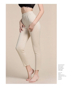 Close-up detail of thermal silk knit leggings showing the high waist elastic waistband