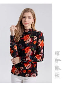 Detail of premium wool turtleneck top with vibrant floral print and elegant mock neck design