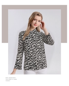 Detail of premium silk long sleeve shirt with classic collar and black-white letter print