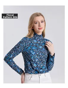 Close-up of women's turtleneck wool top featuring blue floral print and soft fabric texture