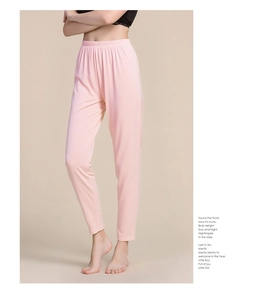 Detail of light pink silk thermal pants featuring elastic waist and soft knit fabric