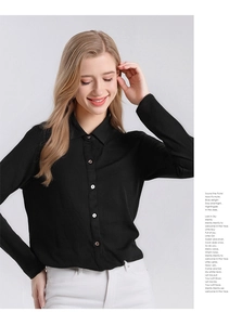 Détail d'une chemise en laine mérinos noire ajustée avec col boutonné classique