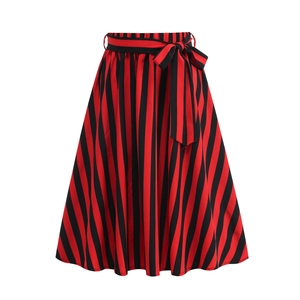 Detail of high-waist striped A-line skirt with a decorative matching fabric bow belt