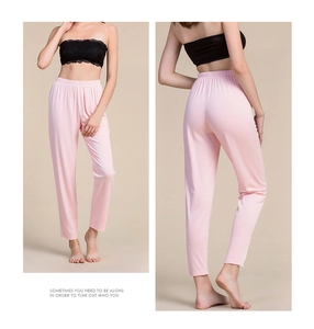 Detailed view of women's silk thermal trousers featuring elastic waist and slim fit design