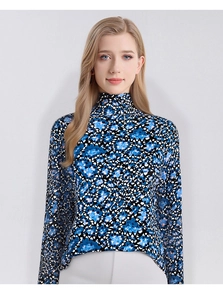Detail of thin turtleneck sweater featuring blue and white abstract floral print pattern