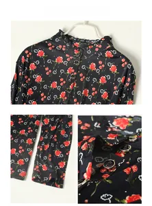 Detailed view of silk printed shirt with stand collar and red rose floral pattern