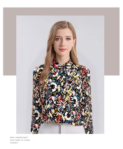 Detailed view of women's silk long sleeve shirt with vibrant abstract art print patterns