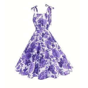 Detail of high waist floral print dress with adjustable bow shoulder straps and purple flowers