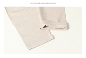 Detailed close-up of premium silk knitted long sleeve cuff showing delicate stitch texture