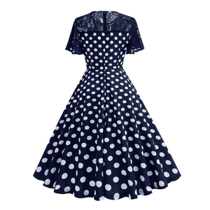 Detail of navy polka dot dress with delicate lace sleeves and a concealed back zipper