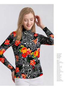 Close-up of floral print and geometric patterns on a merino wool turtleneck sweater