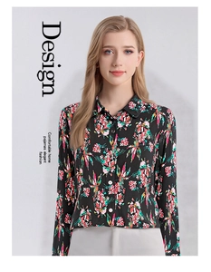 Detail view of long-sleeved silk shirt with floral print and white button closure