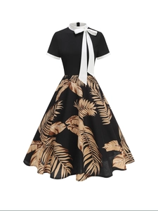 Vintage 1950s Audrey Hepburn style black and white floral print A-line summer dress