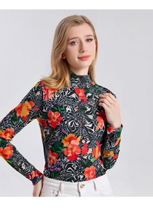 Detailed view of women's turtleneck wool top with vibrant floral and abstract print