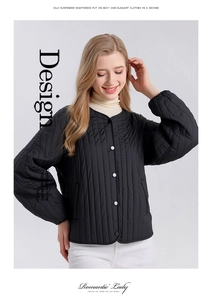 Detailed view of the vertical quilting and elastic cuffs on this black silk-filled jacket