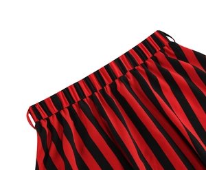 Detail shot of a-line striped skirt showing elastic waistband with red and black stripes