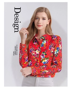 Detail shot of vibrant floral silk blouse featuring a classic collar and colorful print