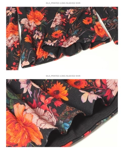 Close-up of wool shirt fabric with vibrant orange floral print and silky texture