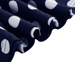 Detailed macro view of navy blue polka dot fabric texture with knit pattern folds