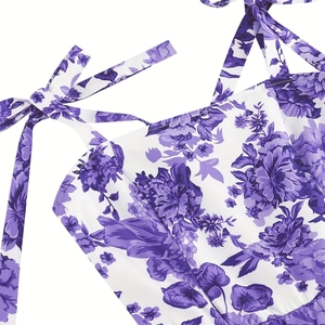 Detailed close-up of adjustable shoulder bow tie on floral print summer dress