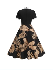 Retro black short sleeve dress with white collar and palm leaf print back view