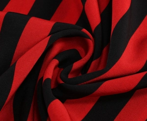 Detail shot of the red and black striped fabric texture with close-up of soft weaving material