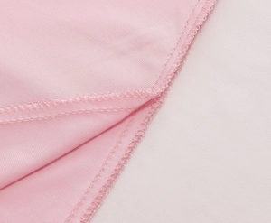 Detailed close-up showing precise edge stitching on pink high-waist flamingo skirt fabric