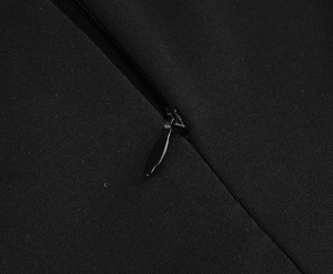 Macro detail of high-quality invisible back zipper on vintage black printed dress