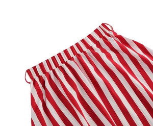 Detailed macro view showing the elastic waistband and vertical red and white stripes of the skirt