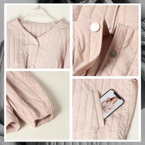 Pink V-neck quilted jacket made of 100% silk padding with functional side pockets