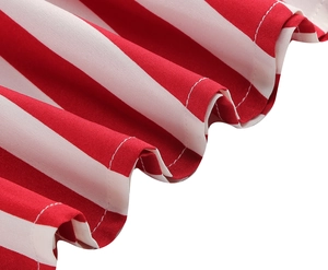 Detailed close-up of red and white striped fabric with ruffled edges and twill texture