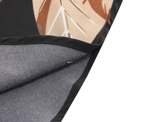Detailed macro view of retro floral print fabric with high-quality black stitched edges